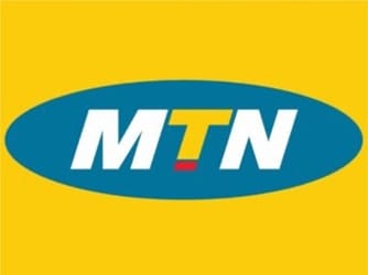 The image shows the MTN logo: bold white letters “MTN” in an oval shape with a blue background, centered on a solid yellow rectangle. The letter “T” is yellow with a small red underline.