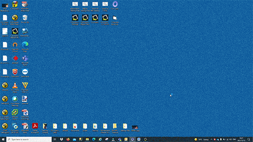 A Windows desktop with a solid blue background is shown. Numerous icons—including those for corporate communications software—are arranged on the left, top, and bottom. The user right-clicks and selects “Refresh,” causing the screen to briefly blink, but nothing else visibly changes.